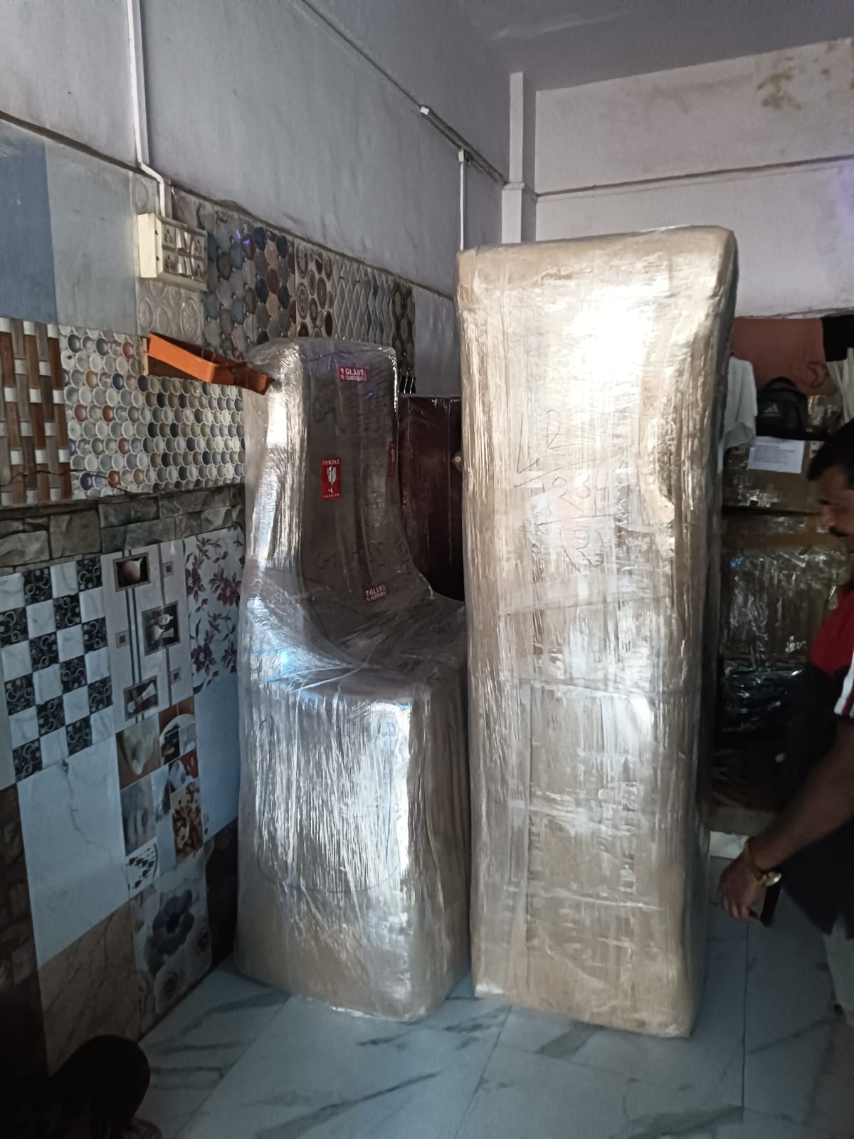 Fridge and mattress wrapped and ready for house shifting in Mulund